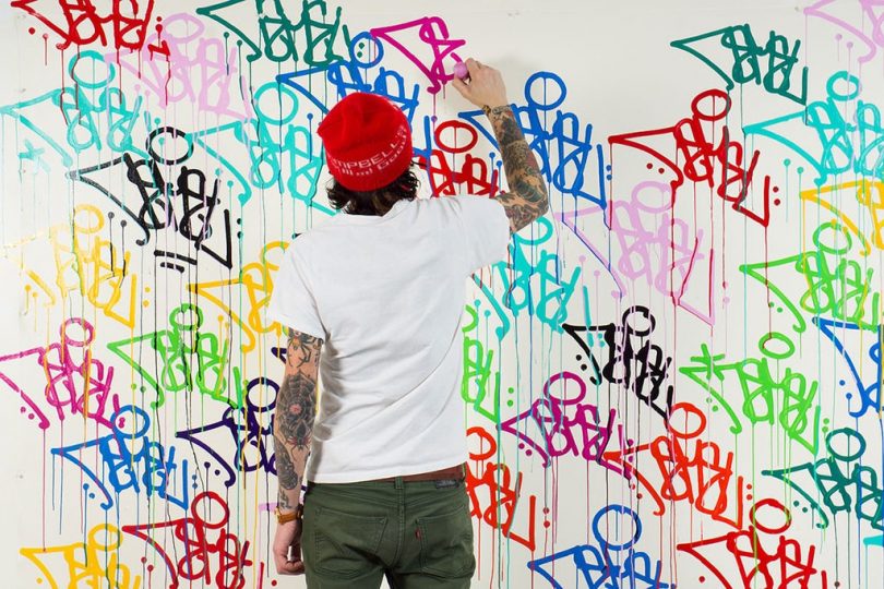 graffiti artist using krink k60 paint marker