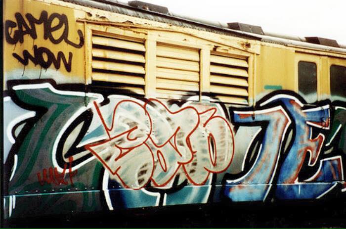 Cap graffiti diss on a subway train