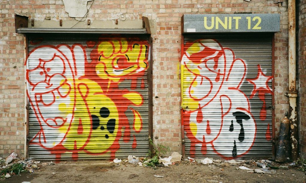 Oker graffiti on shutters in London