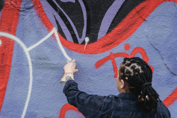 graffiti artist painting clean lines